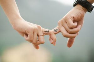 young couple holding hands